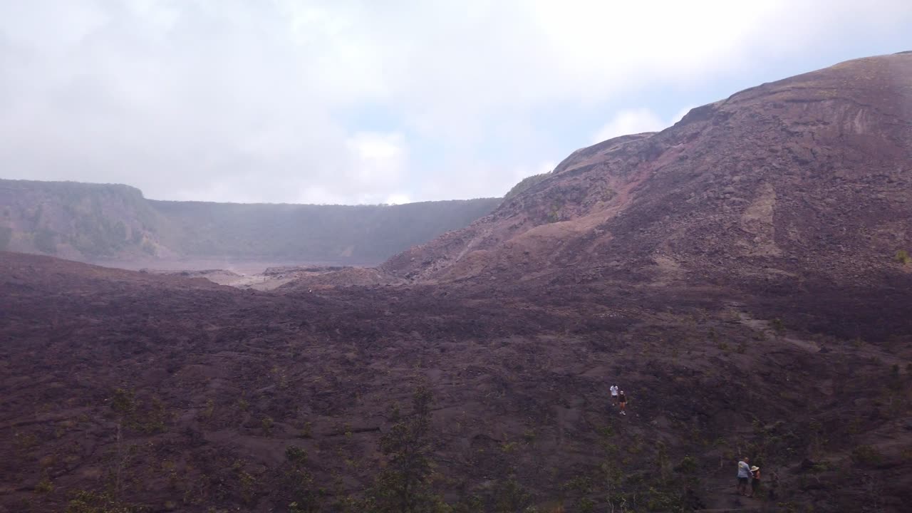 Gimbal wide panning shot from the the Kilauea Iki trail from the bottom surface of the dry lava lake bed in Hawai'i Volcanoes National Park