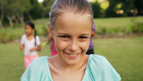 Portrait-of-girl-smiling-in-garden