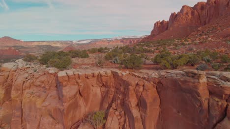 quick aerial fly-over of a red rock cliff near southern utah's capitol reef national park