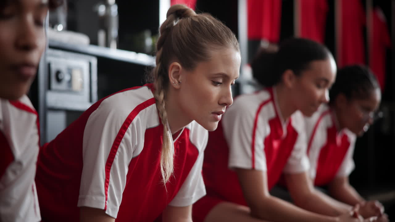 Team of women athletes in a locker room