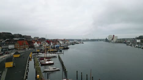 Drone-Flight-over-the-streets,-next-to-the-harbour-of-the-historic-city-in-Flensburg,-Germany