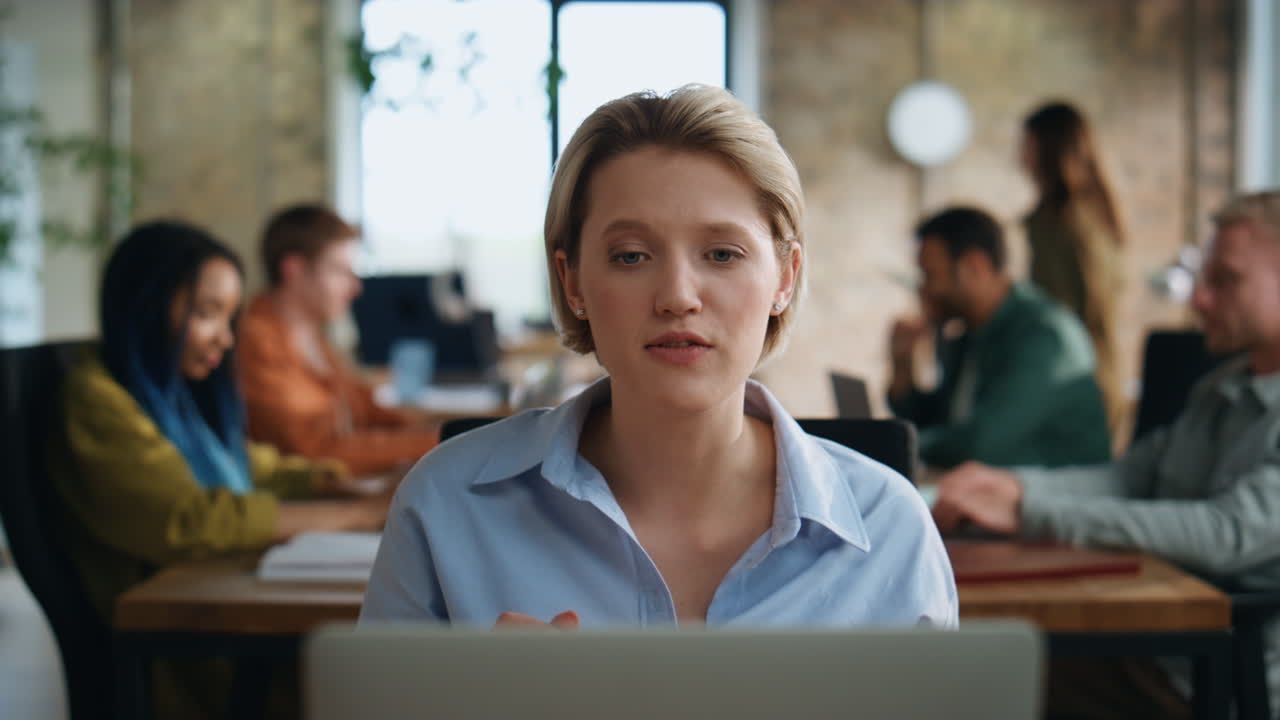 Business woman video calling sitting coworking space closeup. Lady have webinar