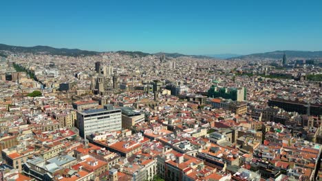 aerial view of gothic quarter in barcelona and sagrada familia in the background. catalonia, spain