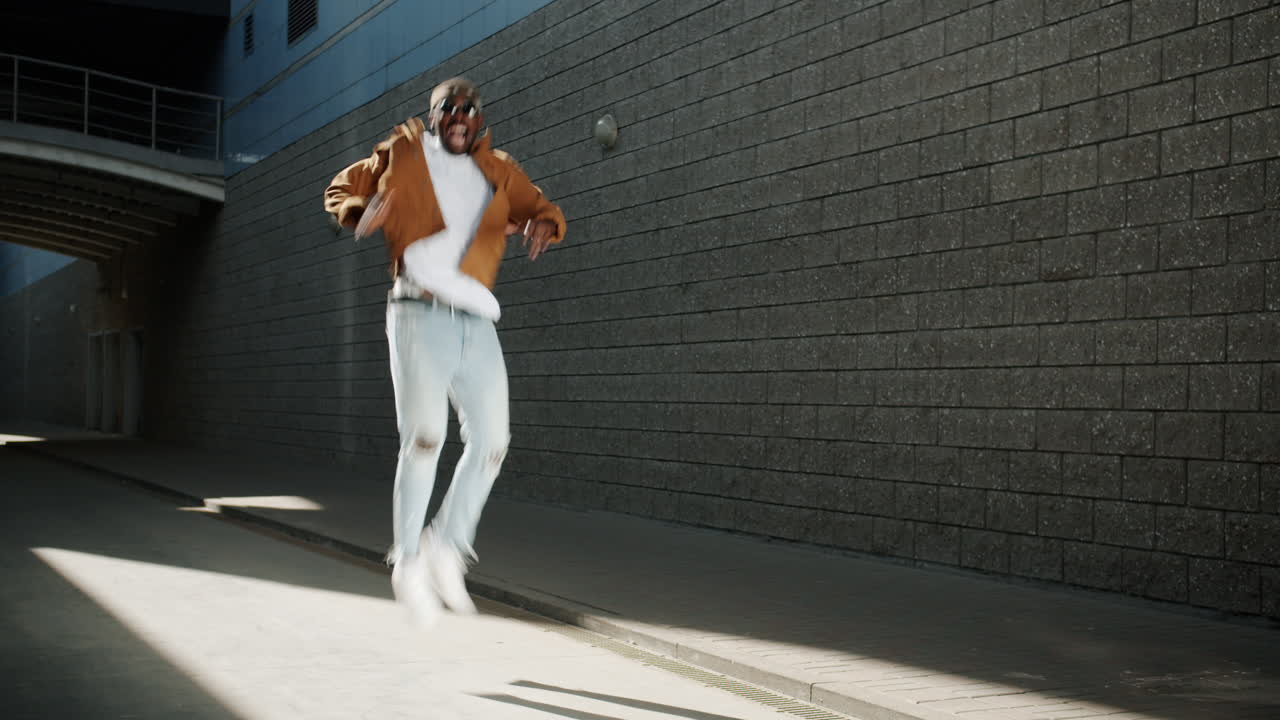 Man jumping for joy on city street