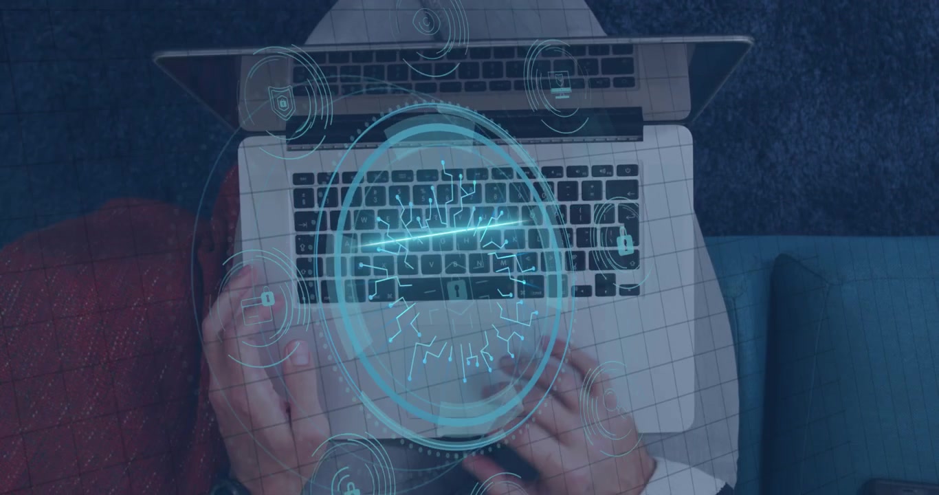 Animation of network of connections with icons over caucasian businessman using laptop