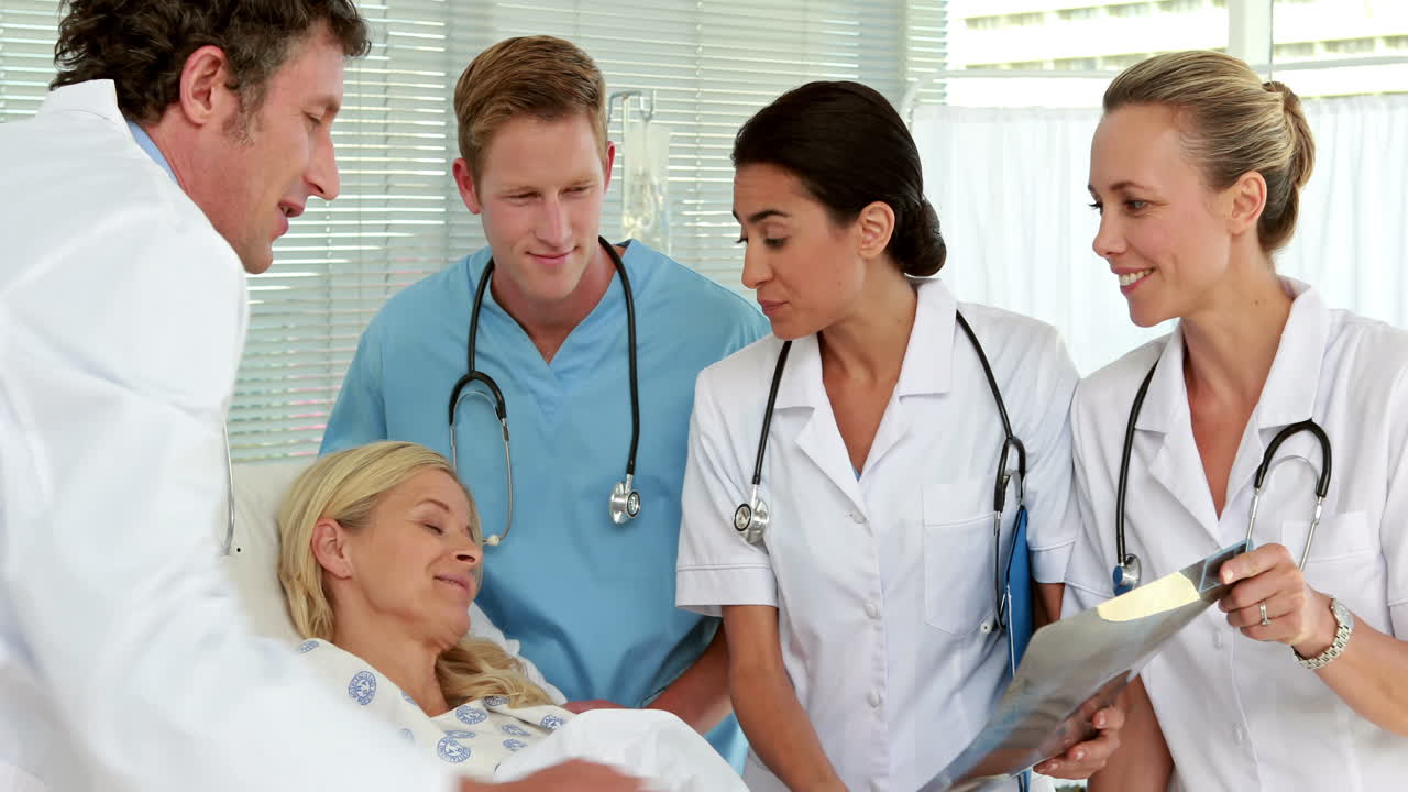 Medical team showing Xray to patient