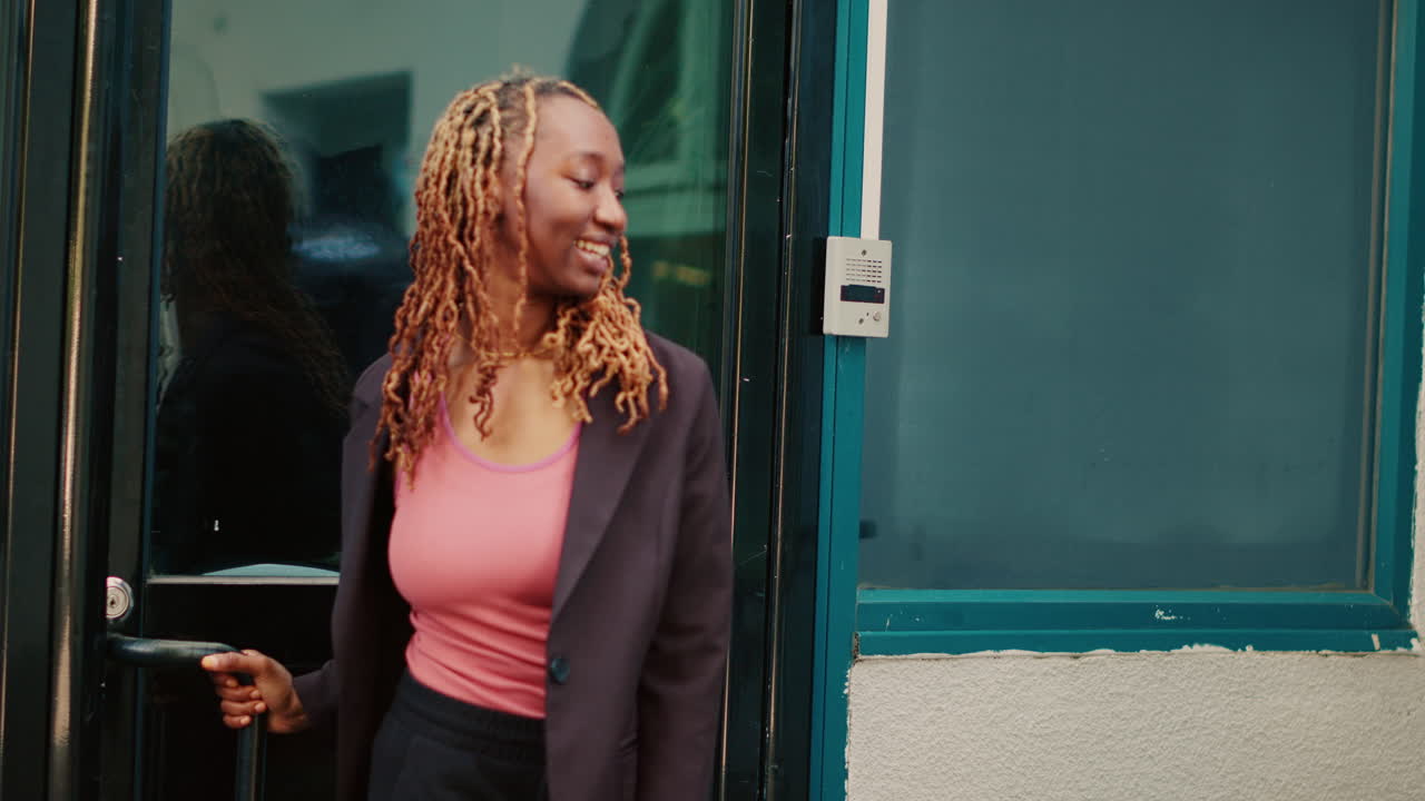 A woman standing in front of a building