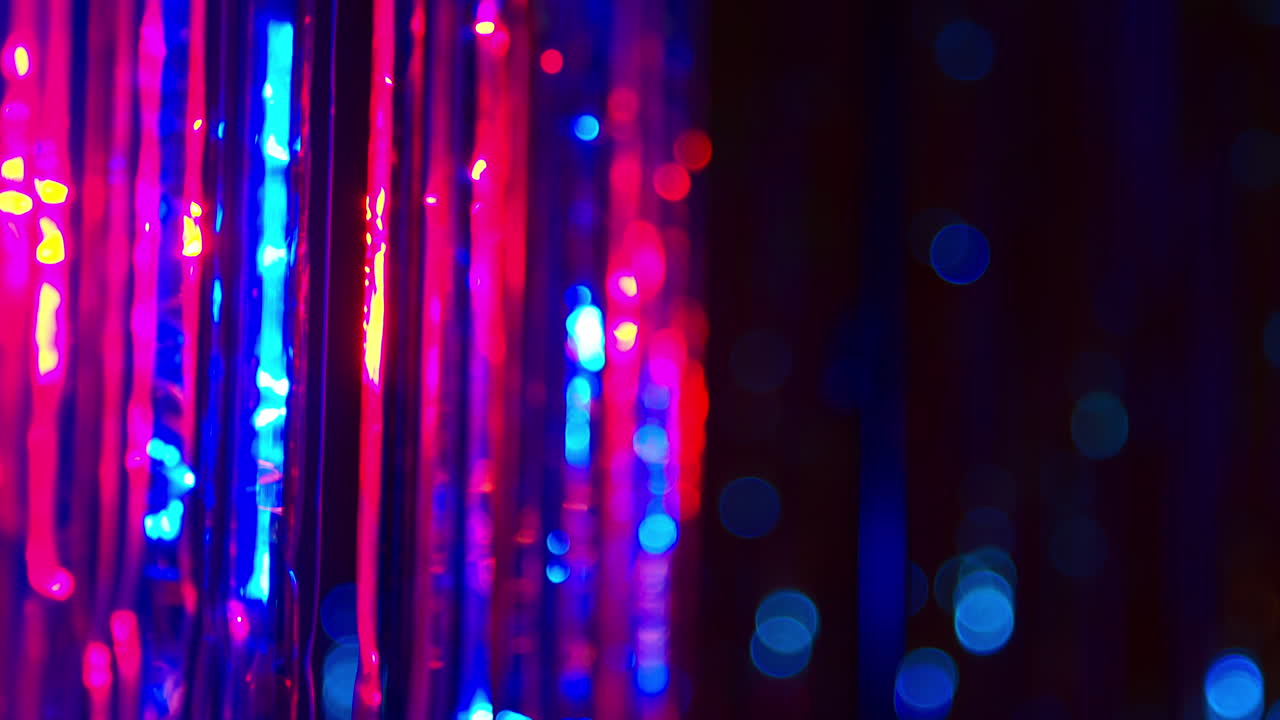 Defocused Close Up Shot Of Sparkling Tinsel Curtain In Night Club Or Disco
