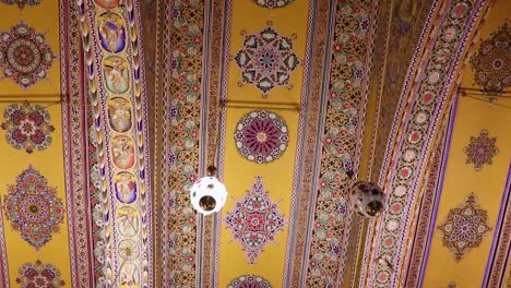artistic design of temple roof with lighted Chandelier from low angle video is taken at Soni Ji Ki Nasiya Jain Temple, Ajmer, Rajasthan, India on Aug 19 2023