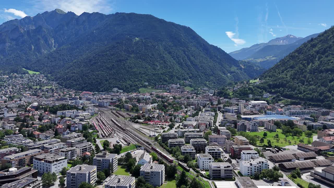 Aerial View of a City Nestled in a Mountain Valley