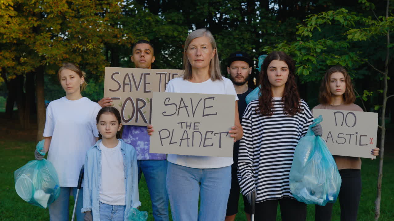 Group of environmental activists holding signs