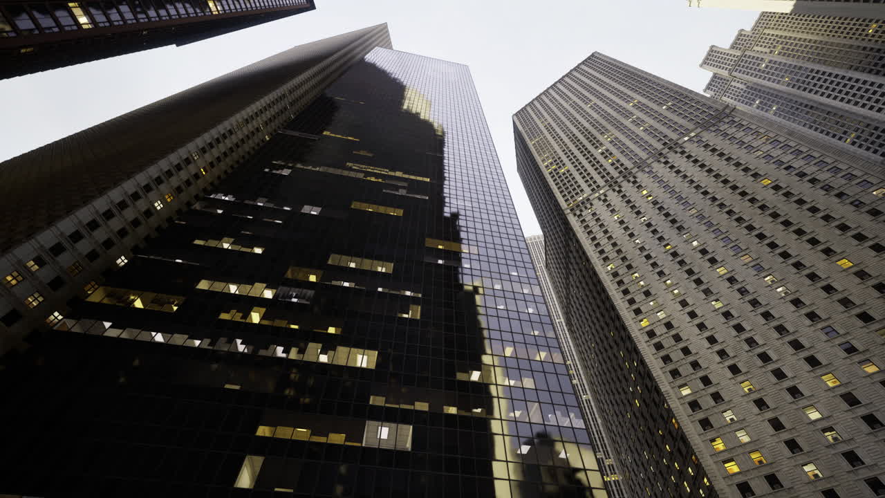 Urban landscape with towering skyscrapers reflecting evening light