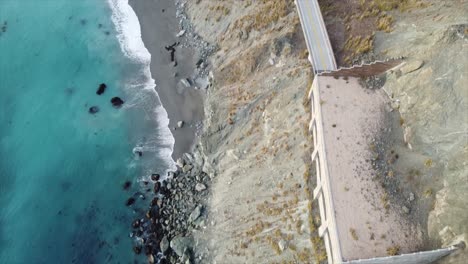 top down drone shot of big sur, ca mountains, ocean, and the pacific coastal highway