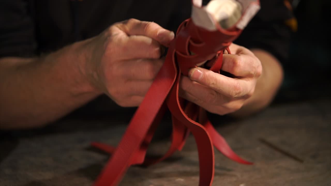 Artisan Crafting Red Leather Braided Straps