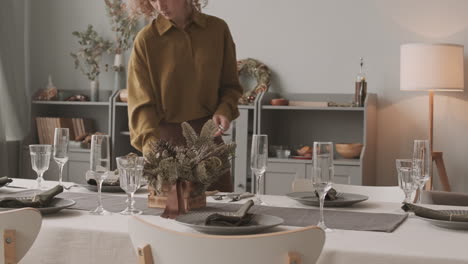 woman laying table professionally