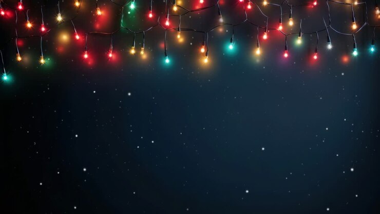 Festive holiday lights hang against a dark starry background. Shot from a low angle, perfect