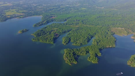 presa rincon reservoirs in the dominican republish, surrounded by lush green vegetation. panoramic aerial view