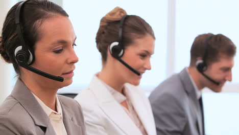 Call-centre-agents-talking-with-headsets