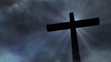 glowing silhouette cross against dark clouds background