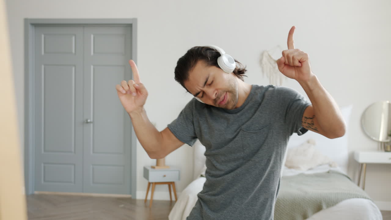 Man Listening to Music and Video Calling