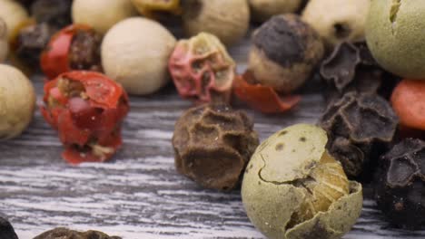 macro close-up mixed peppercorns. dry mix peppercorns close up