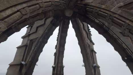 tilting downward shot from the spire of the wallace monument showing fog covering the views