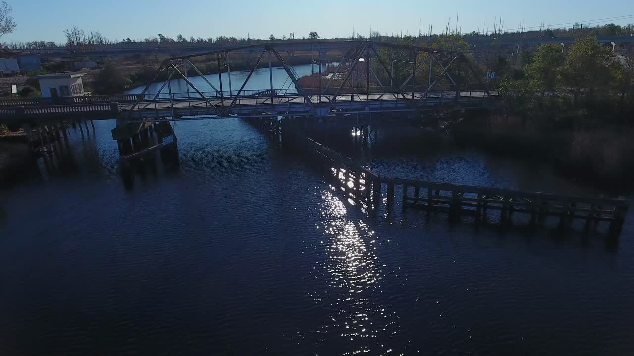 Aerial View of an Old, Rusty and Partially Collapsed Bridge over a River