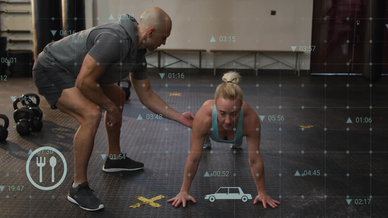 Woman pushing up on coach cue in gym, trainer guiding form with kettlebells and overlaid metrics