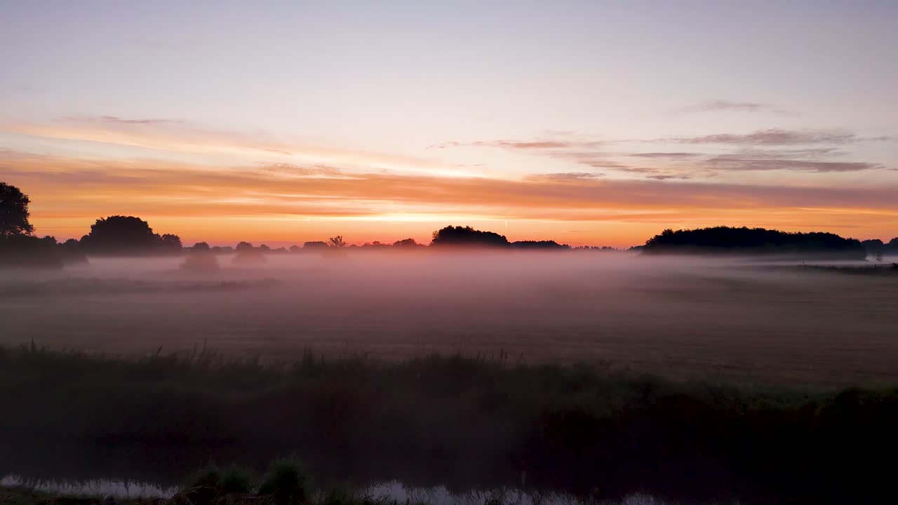 Foggy Sunrise Over a Field