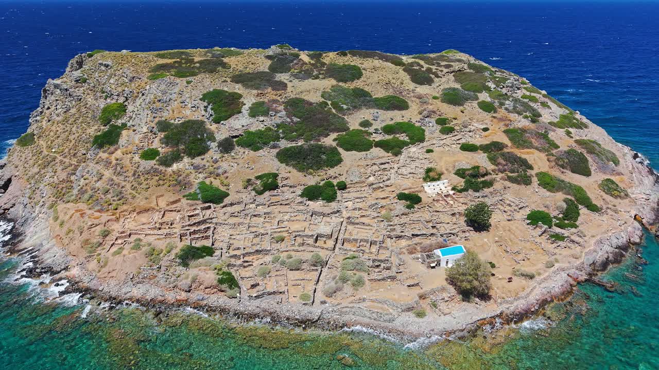 Aerial drone view of the islet of Mochlos in Crete, Greece with ancient Minoan ruins