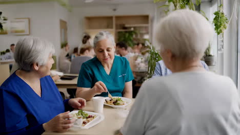 elderly women having lunch in a nursing home