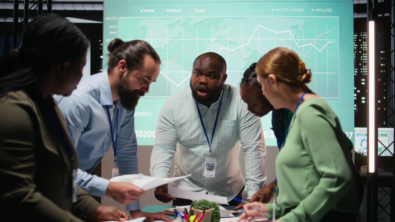 Diverse coworkers team participating in a late night briefing session