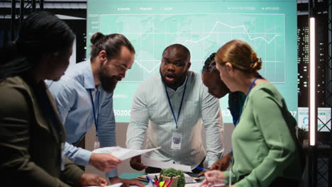 diverse coworkers team participating in a late night briefing session