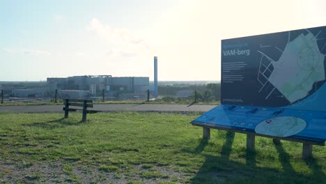 industrial plant with information board at a scenic overlook