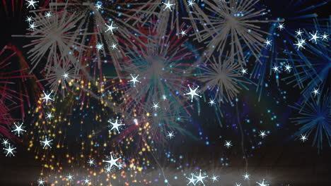 animation of white stars falling over colourful christmas and new year fireworks