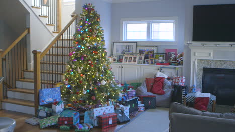 christmas tree in living room with presents underneath