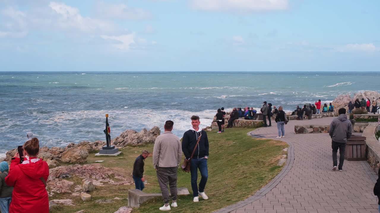 Visitors in Hermanus doing land based whale watching at Gearing's Point