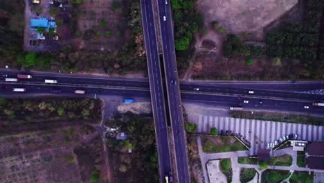 nagpur outer ring road with oxygen bird park jamtha and vehicles at jamtha, nagpur, maharashtra, india. day time, spin shot, moving up, drone shot, 4k.