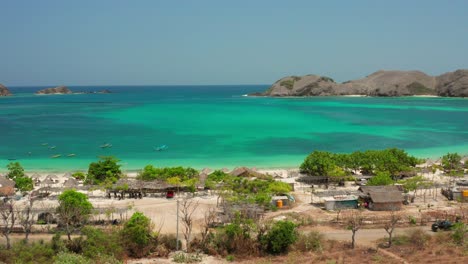 the white sand beach of tanjung aan in lombok, indonesia during a sunny day