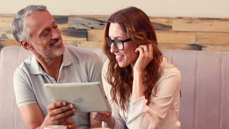 happy friend discussing about tablet computer
