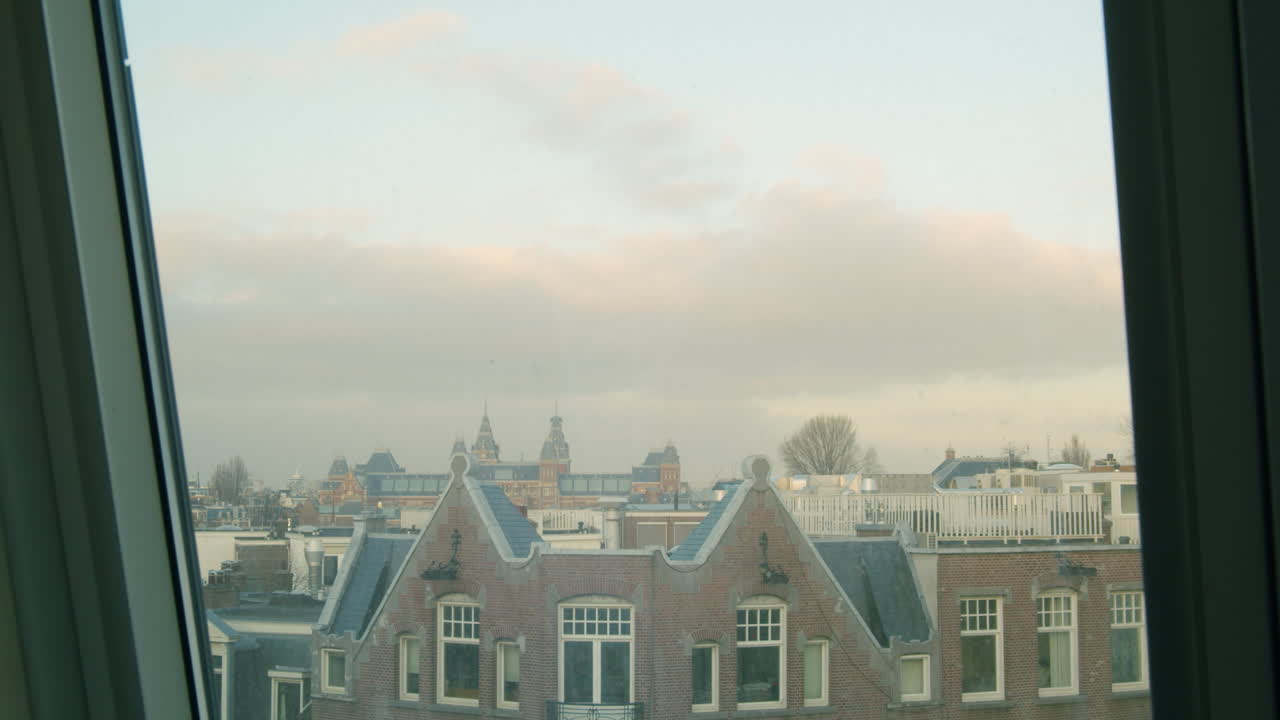 The Amsterdam Skyline with tipical Dutch buildings on a cloudy day.