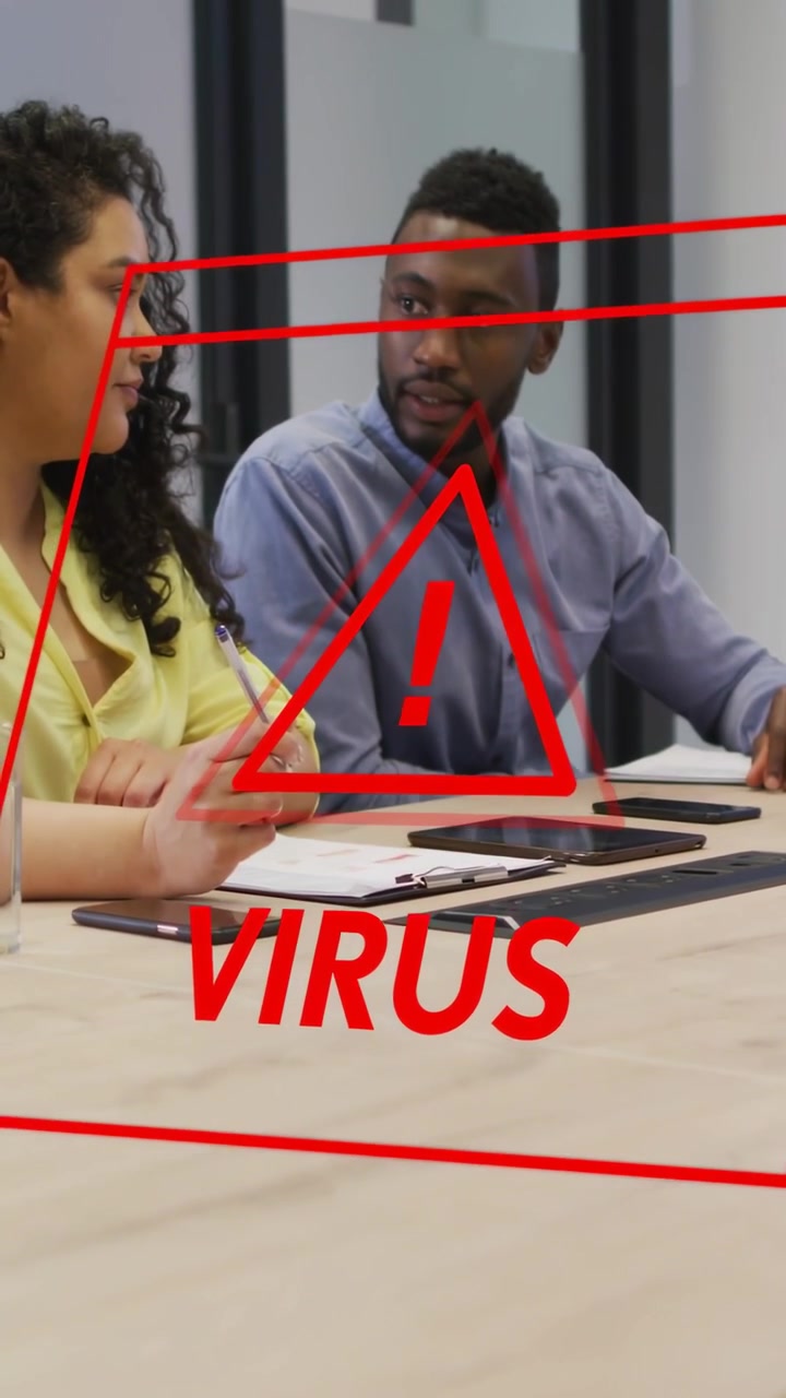 Vertical video: Red VIRUS alert glitching over business desk, two staff responding, man pointing