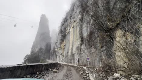 vehicles driving on steep walled roads
