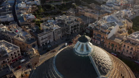 aerial revealed dome of the neoclassical roman catholic sanctuary of mosta rotunda in mosta, malta