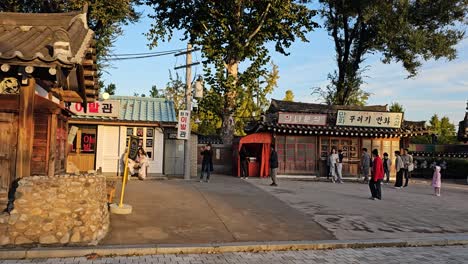 people reliving nostalgia on the street of memories at the national folk museum, seoul, south korea - sideways shot