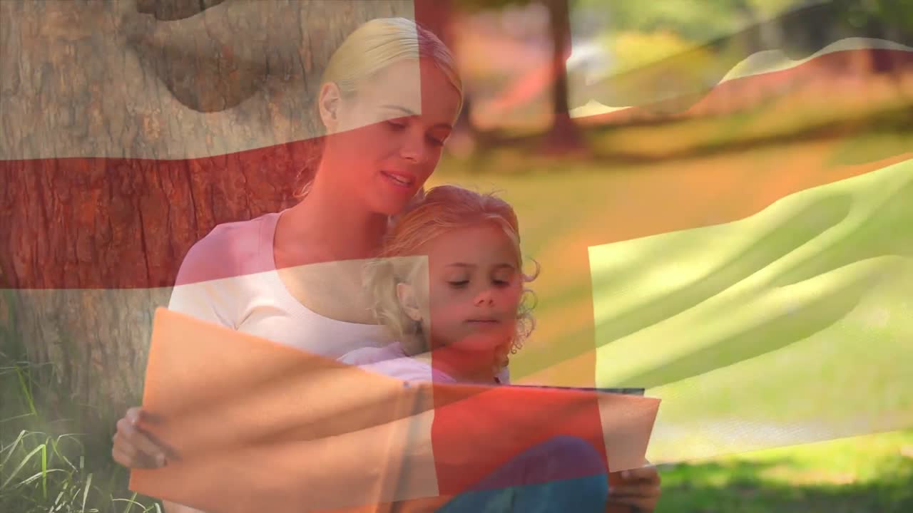 animación de la bandera de inglaterra sobre madre caucásica leyendo un libro con su hijo