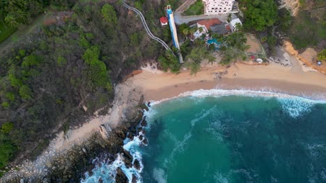 Aereial-view-Playa-Coral,-is-a-gorgeous-hidden-beach-in-Puerto-Escondido,-Oaxaca-Mexico