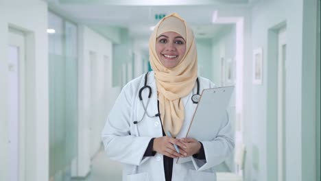 happy muslim doctor listening to patient