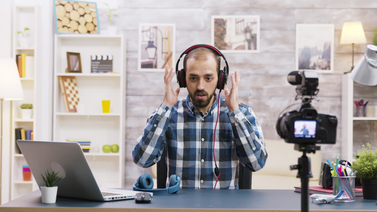 Man reviewing headphones on his vlog