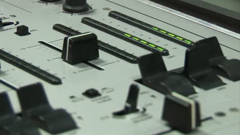 person using a mixing desk